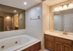 The master bath also has a jacuzzi tub and vanity.
